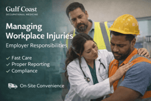 Medical professional providing first aid to injured worker wearing a yellow safety helmet, emphasizing workplace injury management and employer responsibilities.